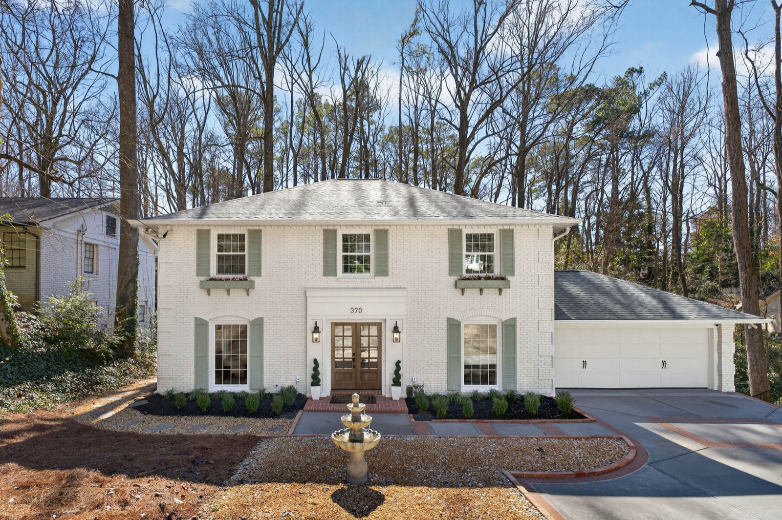 A white brick home represented by Tatum McCurdy in metro Atlanta